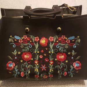 Black purse with flowers